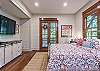Flat screen TV with cable in queen bedroom.