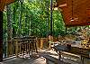 Enjoy the fresh air and woodland views on the porch