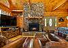 Spacious living room w/ floor to ceiling windows.