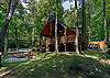 Outdoor fire pit & hot tub at Pine Creek Cabin