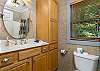 Upper level king bedroom bathroom w/ shower/tub combo.