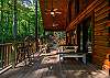 Enjoy the fresh air and woodland views on the porch