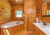 Master bathroom w/ soaking tub and walk-in shower.