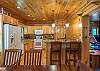 Dining area opens up into kitchen- island seating for 2.