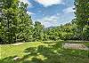Large front yard w/ horse shoe pit.