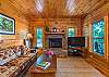 Living room w/ gas logs and Apple TV (streaming only).
