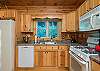 Kitchen includes dishwasher, standard coffee maker & gas range.