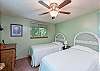 Upper level bedroom with two twin beds