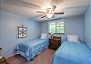Upper level bedroom with two twin beds