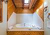 Large soaker tub in main level bath.