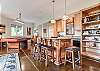 Lower level kitchenette w/ wet bar and wine cooler.