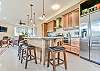 Chef's kitchen w/ gas range & dishwasher.