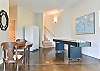 Lower level den w/ shuffle board table & second refrigerator.