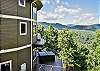 Each level with a deck and mountain views.