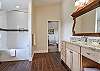Queen bedroom bathroom w/ shower/tub combo.