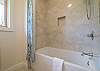 Jack and Jill bath w/ shower/tub combo.