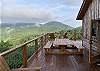 Outdoor dining with an incredible view on the wraparound deck