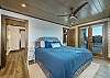 Main level bedroom w/king bed & patio access