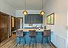 Lower level kitchenette w/bar seating for 3