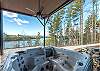 Soak in the luxe hot tub with a glass of wine
