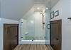 Upper level sleek walk-in shower