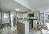 Open kitchen w/stainless appliances & granite countertops