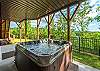 Covered hot tub on the lower level patio