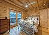 Main level bedroom w/queen,deck access & smart TV