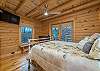 Main level bedroom w/queen,deck access & smart TV