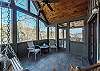 Screened-in porch w/swing & additional seating at the guest hous
