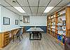 Crafting room with 9’ walnut table & two dedicated workstations
