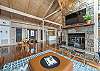 Main living area w/natural gas fireplace & game table