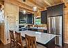 Craft delicious meals with your loved ones in the sleek kitchen