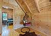 Rattan hanging chair in the upstairs loft