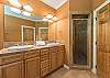 En suite bath w/soaking tub, walk-in shower, and double vanity