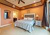 Primary bedroom w/king bed, smart TV, patio access