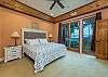 Primary bedroom w/king bed, smart TV, patio access