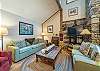Cozy living room area w/wood-burning fireplace,