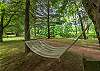 Lounge in a hammock under the shade to