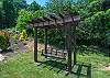 Adorable swing in the front yard