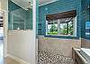 En suite bath w/double vanity & sleek walk-in shower