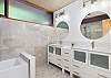 Sleek bath w/double vanity & shower tub combo