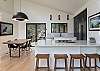 Sleek kitchen & dining areas w/breakfast bar seating for 4