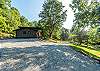 Circular gravel driveway & ample parking area alongside the