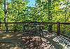 Outdoor dining table w/ seating for 4 on the front porch