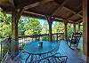 Outdoor dining table w/ seating for 4 on the wraparound porch