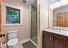 Apartment bathroom w/ walk-in shower.