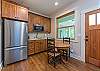 Apartment entrance and kitchenette.