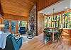 Main level den w/ wood fireplace & table seating for 6.
