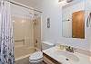 Full hall bath on main level w/ shower/tub combo.